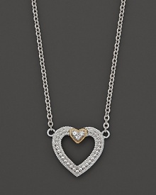 Modern open heart pendant necklace with white sapphires and 18 Kt. gold accents. Designed by Judith Ripka.