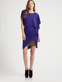 This artfully draped style features two different sleeves--one ruched, one flowing and loose--and a strategic jeweled panel on the skirt.Jewel necklineShort sleevesRuching at shoulderDraped skirtSheer jeweled front panelDeep V backAbout 18½ from natural waistPolyesterDry cleanImportedModel shown is 5'9½ (176cm) wearing us size Small. This artfully draped style features two different sleeves--one ruched, one flowing and loose--and a strategic jeweled panel on the skirt.Jewel necklineShort sleevesRuching at shoulderDraped skirtSheer jeweled front panelDeep V backAbout 18½ from natural waistPolyesterDry cleanImportedModel shown is 5'9½ (176cm) wearing us size Small.