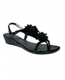 Embrace the season with the Vivian sandals by Adrienne Vittadini. Twin flower accents trim the vamp and a stacked wedge is just high enough to give you a comfortable boost. Embrace the season with the Vivian sandals by Adrienne Vittadini. Twin flower accents trim the vamp and a stacked wedge is just high enough to give you a comfortable boost.