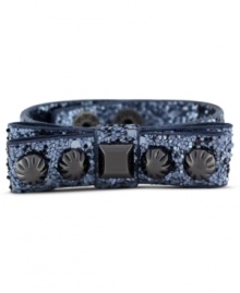 Put a bow on it. This Jessica Simpson bracelet features a hematite tone studded bow with gray glitter detail. Crafted in hematite tone mixed metal. Approximate length: 8 inches. Put a bow on it. This Jessica Simpson bracelet features a hematite tone studded bow with gray glitter detail. Crafted in hematite tone mixed metal. Approximate length: 8 inches.