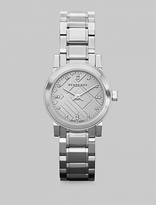 A sleek stainless steel design that features an iconic check dial with diamond markers. Quartz movementWater resistant to 5 ATMRound stainless steel case, 26mm (1)Smooth bezelSilvertone check dialSixteen diamond hour markersStainless steel link braceletMade in Switzerland A sleek stainless steel design that features an iconic check dial with diamond markers. Quartz movementWater resistant to 5 ATMRound stainless steel case, 26mm (1)Smooth bezelSilvertone check dialSixteen diamond hour markersStainless steel link braceletMade in Switzerland