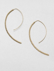 Delicate faceted beads line up along the arc of an artfully shaped hoop with a modern appeal.14k yellow goldLength, about 2Hoop wireMade in USA