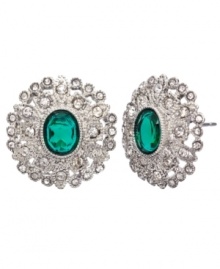 Green party. You'll look festive and fashionable in Monet's button stud earrings. Featuring emerald-hued resin as well as glittering crystals and glass accents, they're made in silver tone mixed metal. Approximate diameter: 3/4 inch. Green party. You'll look festive and fashionable in Monet's button stud earrings. Featuring emerald-hued resin as well as glittering crystals and glass accents, they're made in silver tone mixed metal. Approximate diameter: 3/4 inch.
