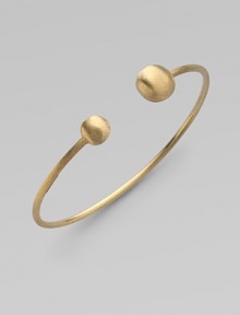From the Africa Collection. Two 18k yellow gold orbs bookend this open bangle design.18k yellow gold Diameter, about 7 Made in Italy From the Africa Collection. Two 18k yellow gold orbs bookend this open bangle design.18k yellow gold Diameter, about 7 Made in Italy