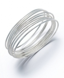 Easy slip-on style with a unique sandblast design. This chic bangle set by Alfani is crafted in silver tone mixed metal. Nine bangles included in set. Approximate diameter: 2-3/4 inches. Easy slip-on style with a unique sandblast design. This chic bangle set by Alfani is crafted in silver tone mixed metal. Nine bangles included in set. Approximate diameter: 2-3/4 inches.