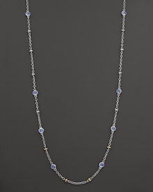 Stations of blue topaz shine on this elegant sterling silver necklace with 18K yellow gold accents. By Judith Ripka. Stations of blue topaz shine on this elegant sterling silver necklace with 18K yellow gold accents. By Judith Ripka.