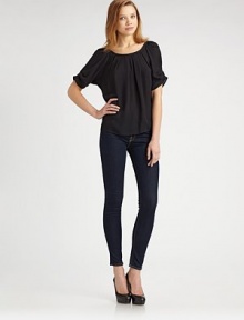 Breezy silk silhouette with a drawstring that pulls in the neckline and ends with a bow at the back. Scoopneck Gathered short sleeves About 22 from shoulder to hem Silk Dry clean Imported Breezy silk silhouette with a drawstring that pulls in the neckline and ends with a bow at the back. Scoopneck Gathered short sleeves About 22 from shoulder to hem Silk Dry clean Imported