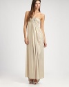 This dazzling, flowy design features an alluringly low-draped back and a jeweled cutout detail at the bust.Strapless necklineJeweled cutout detailRuched bustGathered frontLow draped back with gathered back panel strapAbout 44 from natural waist91% polyester/9% spandexHand washMade in USA of imported fabric