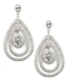Glitter and glamour! A distinctive orbital design sets apart these stunning drop earrings from Givenchy. Adorned with dazzling glass accents and sparkling crystals, they're set in silver tone mixed metal. Approximate drop: 2-1/4 inches. Glitter and glamour! A distinctive orbital design sets apart these stunning drop earrings from Givenchy. Adorned with dazzling glass accents and sparkling crystals, they're set in silver tone mixed metal. Approximate drop: 2-1/4 inches.