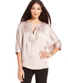 An intricate cutout floral pattern at the neckline gives this flowing Alfani top a romantic feel. Its ultra-feminine approach means it's the perfect way to dress up your black pants. An intricate cutout floral pattern at the neckline gives this flowing Alfani top a romantic feel. Its ultra-feminine approach means it's the perfect way to dress up your black pants.