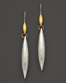 Hammered white silver drop earring cast in an oblong teardrop with 24 Kt. yellow gold accents. Hammered white silver drop earring cast in an oblong teardrop with 24 Kt. yellow gold accents.