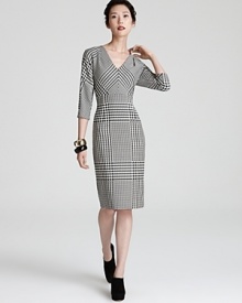 Classic houndstooth takes on a flattering feminine silhouette in this office-perfect Escada dress. Classic houndstooth takes on a flattering feminine silhouette in this office-perfect Escada dress.