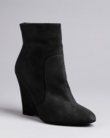 Max Mara strikes the ideal balance between basic and fashion detail in these elegantly crafted wedge booties, with subtle seaming. Max Mara strikes the ideal balance between basic and fashion detail in these elegantly crafted wedge booties, with subtle seaming.