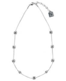 Anne Klein's sophisticated style provides endless style options. This Illusion design boasts numerous fireball accents embellished with sparkling crystals. Crafted in silver tone mixed metal. Approximate length: 16 inches + 2-inch extender. Anne Klein's sophisticated style provides endless style options. This Illusion design boasts numerous fireball accents embellished with sparkling crystals. Crafted in silver tone mixed metal. Approximate length: 16 inches + 2-inch extender.