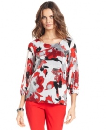 Alfani elevates this top with an abstract floral print and patches of embroidery and sequins. Alfani elevates this top with an abstract floral print and patches of embroidery and sequins.
