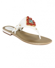 The focal point of fashion. Tahari's Dash flat thong sandals feature a colorful jewel detail at the vamp that will complement any of the season's pretty outfits.