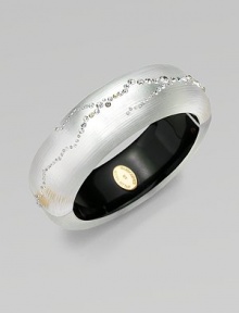 From the Lucite Star Dust Collection. A subtly textured bangle in a lustrous silver color, crafted of hand-sculpted, hand-painted Lucite, sprinkled with shimmering Swarovski crystals.LuciteCrystalDiameter, about 2¼Width, about ¾Hinged with magnetic claspMade in USA From the Lucite Star Dust Collection. A subtly textured bangle in a lustrous silver color, crafted of hand-sculpted, hand-painted Lucite, sprinkled with shimmering Swarovski crystals.LuciteCrystalDiameter, about 2¼Width, about ¾Hinged with magnetic claspMade in USA