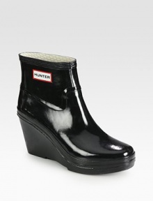 Waterproof classic with a rubber wedge and platform. Rubber wedge, 3 (75mm)Rubber platform, 1 (25mm)Compares to a 2 heel (50mm)Rubber upperJersey knit liningRubber solePadded insoleImportedOUR FIT MODEL RECOMMENDS ordering true whole size; ½ sizes should order the next whole size up. 