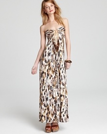 An exotic feather print lends whimsy to this sunny-season Sky strapless maxi dress, punctuated by ethereal feather-adorned chains at the bust. An exotic feather print lends whimsy to this sunny-season Sky strapless maxi dress, punctuated by ethereal feather-adorned chains at the bust.