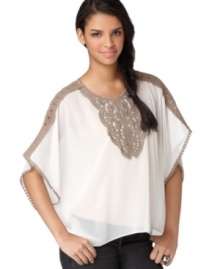 With an embroidered bib front and trendy poncho silhouette, this Bar III blouse is the perfect top for any pair of jeans. With an embroidered bib front and trendy poncho silhouette, this Bar III blouse is the perfect top for any pair of jeans.