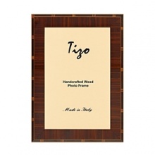 Exquisitely detailed with inlaid marquetry and a high gloss finish, these Italian wood frames offer a perfect way to showcase your pictures. Available in three sizes. Exquisitely detailed with inlaid marquetry and a high gloss finish, these Italian wood frames offer a perfect way to showcase your pictures. Available in three sizes.
