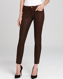 Uniquely treated to look like leather but feel like well-worn denim, these rockstar-chic GUESS jeans exude a cool downtown vibe in a classic five-pocket silhouette. Uniquely treated to look like leather but feel like well-worn denim, these rockstar-chic GUESS jeans exude a cool downtown vibe in a classic five-pocket silhouette.