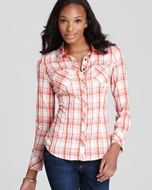 Featuring a vibrant plaid print, a menswear-inspired GUESS shirt lends boyish charm to your favorite jeans. Featuring a vibrant plaid print, a menswear-inspired GUESS shirt lends boyish charm to your favorite jeans.