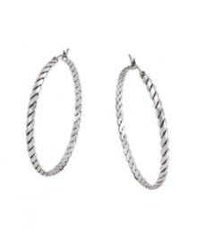 Get all tied up in traditional style with a modern twist. BCBGeneration adds a little extra flair to the classic hoop earring with a unique rope pattern. Crafted in oxidized silver tone mixed metal. Approximate diameter: 1-1/2 inches. Get all tied up in traditional style with a modern twist. BCBGeneration adds a little extra flair to the classic hoop earring with a unique rope pattern. Crafted in oxidized silver tone mixed metal. Approximate diameter: 1-1/2 inches.