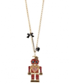 This robot has found love. Betsey Johnson's cute pendant necklace features a long chain displaying a fuchsia glitter robot pendant with blue crystal eyes, pink crystal hearts and gold tone details. A black bow and heart finish off the adorable look. Crafted in antique gold tone mixed metal. Approximate length: 31 inches. Approximate drop: 3 inches. This robot has found love. Betsey Johnson's cute pendant necklace features a long chain displaying a fuchsia glitter robot pendant with blue crystal eyes, pink crystal hearts and gold tone details. A black bow and heart finish off the adorable look. Crafted in antique gold tone mixed metal. Approximate length: 31 inches. Approximate drop: 3 inches.