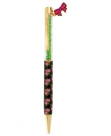 The write stuff. Betsey Johnson's rose-printed pen is crafted from gold-tone mixed metal with green beads and a pink bow charm at the top for a whimsical touch. Item comes packaged in a signature Betsey Johnson Gift Box. Approximate length: 5-1/2 inches. Approximate width: 3/8 inch.