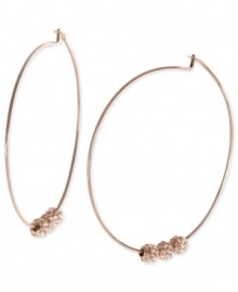 Michael Kors adds an elegant touch to its pair of hoop earrings. Crafted from rose gold ion-plated mixed metal, the earrings feature glass pave fireballs for a lustrous touch. Approximate diameter: 2 inches. Michael Kors adds an elegant touch to its pair of hoop earrings. Crafted from rose gold ion-plated mixed metal, the earrings feature glass pave fireballs for a lustrous touch. Approximate diameter: 2 inches.