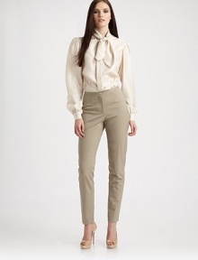 Rich silk twill, styled with soft ties at the neck and curvy shaping at the waist.Tie collarHidden button placketLong, slightly full sleeves with gathered button cuffsInverted pleated darts to shape the waistAbout 23½ from shoulder to hemSilkDry cleanImported Model shown is 5'10 (177cm) wearing US size 4. Rich silk twill, styled with soft ties at the neck and curvy shaping at the waist.Tie collarHidden button placketLong, slightly full sleeves with gathered button cuffsInverted pleated darts to shape the waistAbout 23½ from shoulder to hemSilkDry cleanImported Model shown is 5'10 (177cm) wearing US size 4.