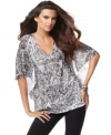 Flowing sleeves and a lacy print make INC's top casual, cute and easy to wear!