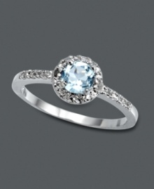 Subtle, simple, and sublime. This elegant Victoria Townsend style features a round-cut blue topaz gemstone (1/2 ct. t.w.) encircled by sparkling diamond accents. Crafted in sterling silver. Size 7. Subtle, simple, and sublime. This elegant Victoria Townsend style features a round-cut blue topaz gemstone (1/2 ct. t.w.) encircled by sparkling diamond accents. Crafted in sterling silver. Size 7.