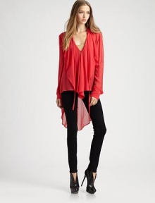 Soft ruffles cascade down the front of this airy silk top, finished with a dramatic hi-lo hem.V-neck with tie closureSingle button closureGathered sleevesAbout 24 from shoulder to hemSilkDry cleanImportedModel shown is 5'9 (175cm) wearing US size Small. Soft ruffles cascade down the front of this airy silk top, finished with a dramatic hi-lo hem.V-neck with tie closureSingle button closureGathered sleevesAbout 24 from shoulder to hemSilkDry cleanImportedModel shown is 5'9 (175cm) wearing US size Small.