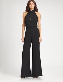 This chic one-piece style transitions flawlessly from day to night.Halter neckline with back tieSleevelessFront keyhole detailBanded waistWide legLow V back with concealed zipFully linedAbout 17 from shoulder to waistInseam, about 34PolyesterDry cleanMade in USA of imported fabricModel shown is 5'11 (180) wearing US size 4. This chic one-piece style transitions flawlessly from day to night.Halter neckline with back tieSleevelessFront keyhole detailBanded waistWide legLow V back with concealed zipFully linedAbout 17 from shoulder to waistInseam, about 34PolyesterDry cleanMade in USA of imported fabricModel shown is 5'11 (180) wearing US size 4.