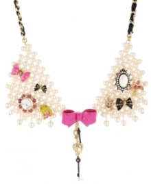 Chic creatures! A bird, a frog and a pig all stand out stylishly on Betsey Johnson's multi charm collar statement necklace. Embellished with bows galore, a key, an intertwined grosgrain ribbon, along with glass pearls and sparkling crystals, it's crafted in antique gold tone mixed metal. Approximate length: 18 inches + 3-inch extender. Chic creatures! A bird, a frog and a pig all stand out stylishly on Betsey Johnson's multi charm collar statement necklace. Embellished with bows galore, a key, an intertwined grosgrain ribbon, along with glass pearls and sparkling crystals, it's crafted in antique gold tone mixed metal. Approximate length: 18 inches + 3-inch extender.