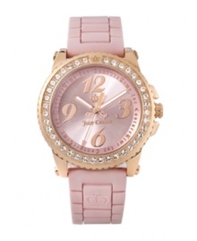 Juicy Couture knows what just what princesses want: pink, pink, pink and dash of gold. Pedigree watch features pink logo-embossed jelly strap and round rose gold-plated stainless steel case. Bezel crystallized with Swarovski elements. Brushed pink dial features rose goldtone logo, numerals at twelve, three, six and nine o'clock and a Time for Couture script ring. Quartz movement. Water resistant to 30 meters. Two-year limited warranty. Juicy Couture knows what just what princesses want: pink, pink, pink and dash of gold. Pedigree watch features pink logo-embossed jelly strap and round rose gold-plated stainless steel case. Bezel crystallized with Swarovski elements. Brushed pink dial features rose goldtone logo, numerals at twelve, three, six and nine o'clock and a Time for Couture script ring. Quartz movement. Water resistant to 30 meters. Two-year limited warranty.