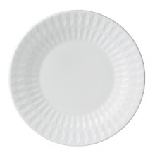 Embossed with clean, geometric patterns comprised of subtle diamond shapes, this attractive set of dinnerware is crafted in pure white bone china for a mannered elegance that complements your finest table setting. Embossed with clean, geometric patterns comprised of subtle diamond shapes, this attractive set of dinnerware is crafted in pure white bone china for a mannered elegance that complements your finest table setting.