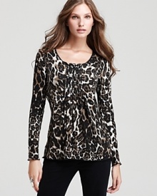 Lined with a seamless lockstitched shapewear tank to slim the figure, this Miraclebody by Miraclesuit top flaunts a chic animal print and shirred detailing for a flirtatious silhouette. Lined with a seamless lockstitched shapewear tank to slim the figure, this Miraclebody by Miraclesuit top flaunts a chic animal print and shirred detailing for a flirtatious silhouette.
