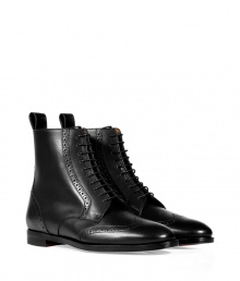 Luxurious boot in high-polished black calf leather - Stylish wingtip design inspired by classic mens footwear - Features a narrow shape, rounded toe, thin laces to ankle, and a mini block heel - Favorite shoe with a pantsuit, knit skirt or skinny jeans Luxurious boot in high-polished black calf leather - Stylish wingtip design inspired by classic mens footwear - Features a narrow shape, rounded toe, thin laces to ankle, and a mini block heel - Favorite shoe with a pantsuit, knit skirt or skinny jeans