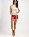Crocheted florals pair with tasseled fringe in this light, open-weave pullover.BoatneckExtended shouldersPullover styleAbout 23 from shoulder to hemRayonDry cleanImportedModel shown is 5'10 (177cm) wearing US size Small.