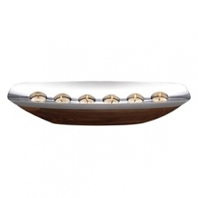 Willowy and compelling, the sloop-shaped centerpiece tealight appears to have been carved from the Amazon tree of the same name. Indeed, the rectangular alloy rim practically floats on its curved acacia wood hull, as the light from the 6 tea lights reflects glimmering light. Todd Myers captured the sprit of the Marupa collection in this stunning centerpiece that will enhance a rustic credenza or a fine dining table as a work of art. Willowy and compelling, the sloop-shaped centerpiece tealight appears to have been carved from the Amazon tree of the same name. Indeed, the rectangular alloy rim practically floats on its curved acacia wood hull, as the light from the 6 tea lights reflects glimmering light. Todd Myers captured the sprit of the Marupa collection in this stunning centerpiece that will enhance a rustic credenza or a fine dining table as a work of art.