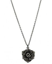 Petals to the metal. This necklace from GUESS is crafted from sprayed-jet mixed metal, with a flower pendant crafted from hematite-tone mixed metal and glass crystals adding luster. Item comes packaged in a signature GUESS Gift Box. Approximate length: 16 inches + 2-inch extender. Approximate drop: 1-1/2 inches. Petals to the metal. This necklace from GUESS is crafted from sprayed-jet mixed metal, with a flower pendant crafted from hematite-tone mixed metal and glass crystals adding luster. Item comes packaged in a signature GUESS Gift Box. Approximate length: 16 inches + 2-inch extender. Approximate drop: 1-1/2 inches.