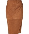 Luxe skirt in sumptuous, supple tobacco suede - A chic classic from American luxury label Ralph Lauren - Feminine and fitted pencil cut creates a flattering silhouette - Elegant wrap style with gathered drape detail - Hits at knee - Slightly higher waist sits comfortably at hips - Zips at back - Versatile and sophisticated, seamlessly transitions from day to evening - Pair with a button down or a silk blouse and platform pumps or sandals