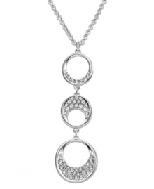 Modern and sophisticated, this pendant offers a beautiful interpretation of a timeless circle motif. Swarovski's fluid design complements a wide variety of outfits. Hanging on a rhodium-plated mixed metal chain, three circular elements are sprinkled with clear crystal pavé for extra sparkle. Approximate length: 15 inches + 2-inch extender. Approximate drop: 1 inches. Modern and sophisticated, this pendant offers a beautiful interpretation of a timeless circle motif. Swarovski's fluid design complements a wide variety of outfits. Hanging on a rhodium-plated mixed metal chain, three circular elements are sprinkled with clear crystal pavé for extra sparkle. Approximate length: 15 inches + 2-inch extender. Approximate drop: 1 inches.