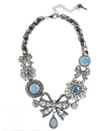 Put a bow on it! Betsey Johnson's darling frontal necklace showcases a crystal-accented bow charms with teardrop charm, round glass opal charms and crystal accents. Setting and chain crafted in silver tone mixed metal. Approximate length: 16 inches + 3-inch extender. Approximate drop: 2-1/4 inches. Put a bow on it! Betsey Johnson's darling frontal necklace showcases a crystal-accented bow charms with teardrop charm, round glass opal charms and crystal accents. Setting and chain crafted in silver tone mixed metal. Approximate length: 16 inches + 3-inch extender. Approximate drop: 2-1/4 inches.