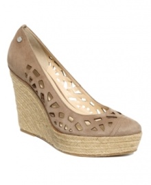 Out in the open. Eye-catching cutouts in suede set apart the stylish Viktoria wedge espadrille sandals by Calvin Klein.