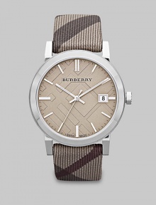 A true signature design with a check etched dial and a check strap. Quartz movementWater resistant to 5 ATMRound stainless steel case, 38mm (1.5) Smooth bezelTrench check stamped dialBar hour markersDate display at 3 o'clockSecond hand Trench smoke check strapMade in Switzerland A true signature design with a check etched dial and a check strap. Quartz movementWater resistant to 5 ATMRound stainless steel case, 38mm (1.5) Smooth bezelTrench check stamped dialBar hour markersDate display at 3 o'clockSecond hand Trench smoke check strapMade in Switzerland