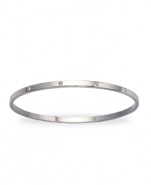 Get noticed for your charming subtlety with this simple matte bangle set with shimmering, clear crystals. Crafted in rhodium-plated mixed metal. Approximate diameter: 3-1/4 inches. Get noticed for your charming subtlety with this simple matte bangle set with shimmering, clear crystals. Crafted in rhodium-plated mixed metal. Approximate diameter: 3-1/4 inches.